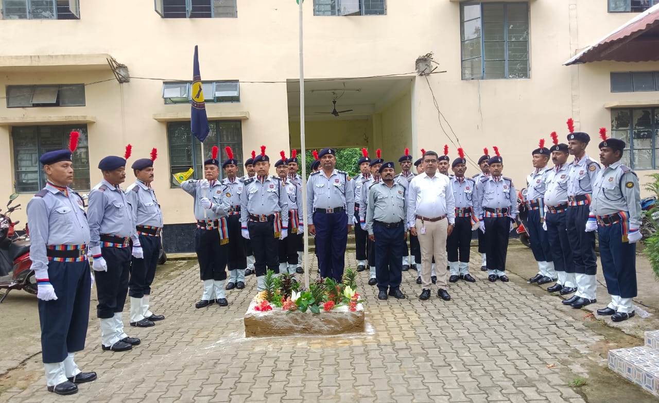 Personnel assembled in a courtyard
